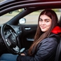 Junior Supercar Driving at The London Circuit Girl Sat Ready to Drive Vehicle